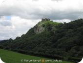 SX16158 Carreg Cennen Castle on top of distant cliffs.jpg