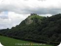 SX16158 Carreg Cennen Castle on top of distant cliffs.jpg